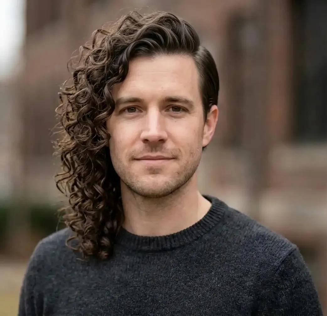 Asymmetric Curly Sweep hairstyle for Men