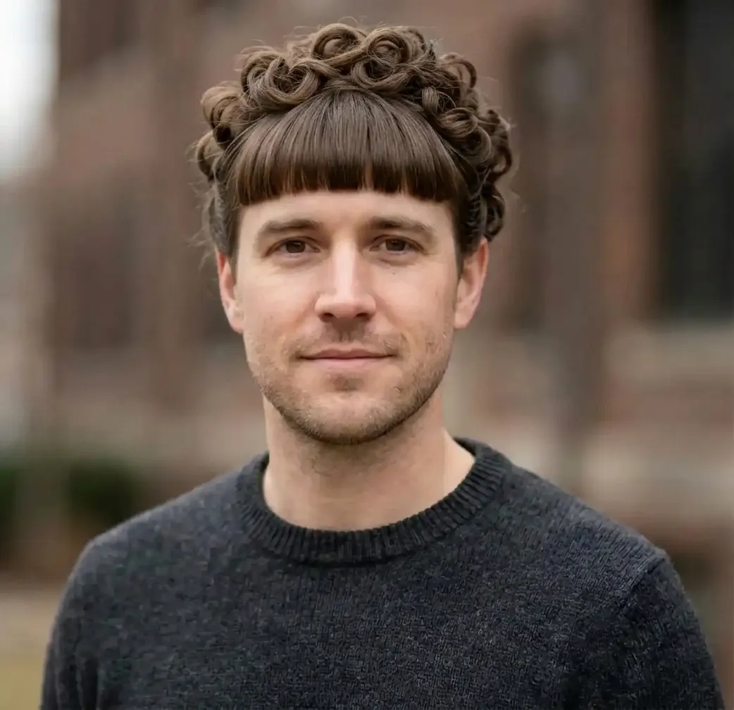 Curly Fringed Updo hairstyle for Men