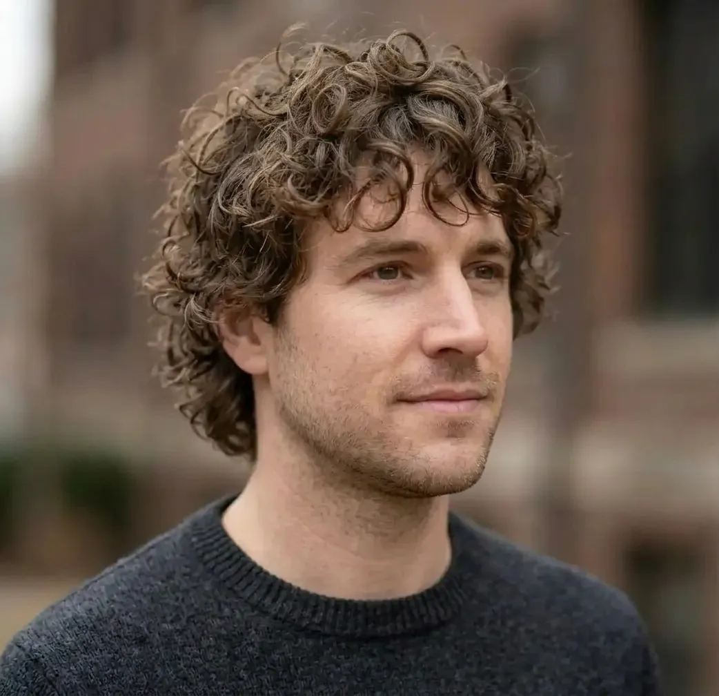 Curly Shag Haircut for men — three-quarter view