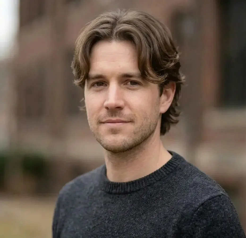 Curtain Bangs Haircut for men — three-quarter view